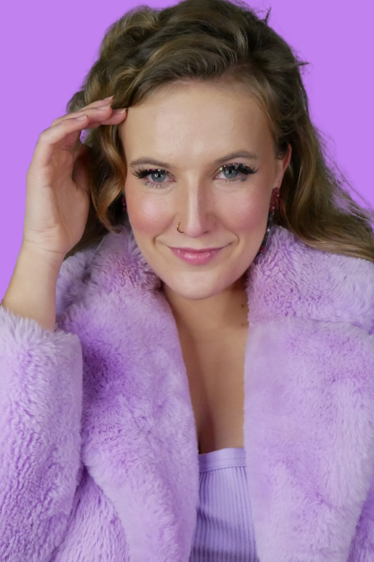 A photo of Millicent Sarre in a purple fluffy jacket