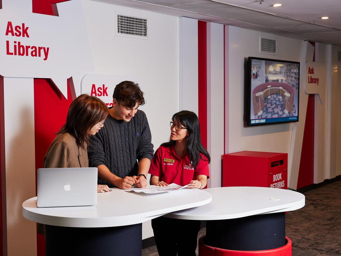 Students getting help from Ask Library desk