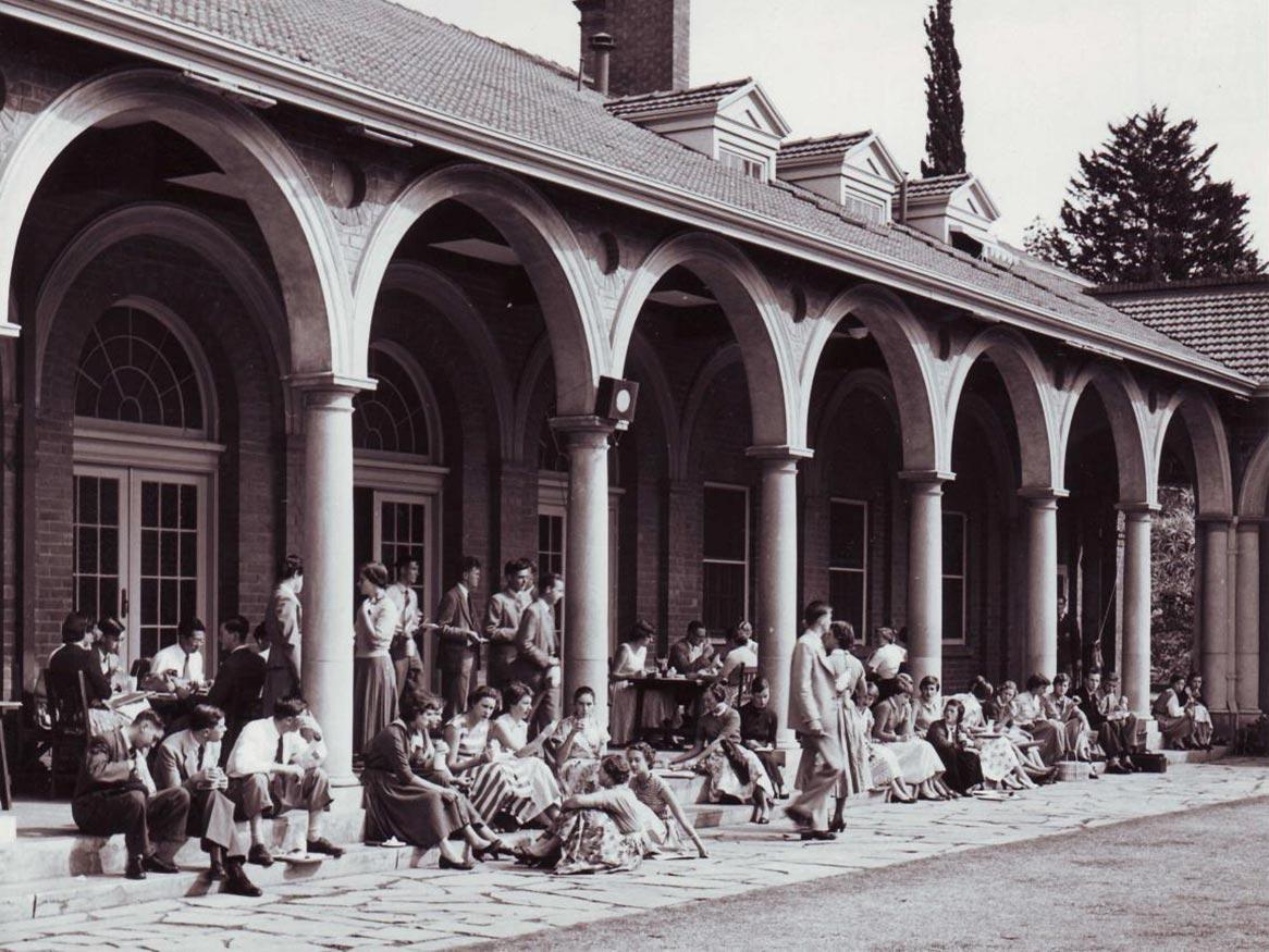 Black & white photograph of Union Cloisters with students gathered in 1955.