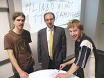Professor Derek Abbott flanked by Electrical & Electronic Engineering students Denley Bihari and Andrew Turnbull, with the code they are hoping to crack
Photo by Candy Gibson