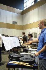 Rehearsing for the concert are percussion students (from left) Luke Hague, Fleur Green and Ryan Simm 
Photo by Ben Osborne