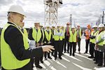 Vice-Chancellor Professor James McWha (far left) addressing staff and key stakeholders at the topping out ceremony atop the new $100 million building
Photo by Andrew Beveridge, asbCreative