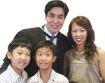 MBA graduate Yee Desmond with his wife Lily and children Raphael and Isaac
Photo by Candy Gibson