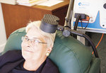 An Adelaide Clinic staff member demonstrates the transcranial magnetic stimulation treatment for depression