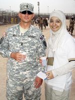 International Studies student Khadhraa Glen with a Military Police officer at the Coalition forces base in Basra, Iraq