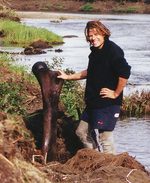 Professor Alan Cooper with a bone from a woolly mammoth