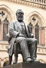 Bronze sculpture of Sir Walter Watson Hughes in front of the Mitchell Building. Sculpture by Francis John Williamson (1833-1920)