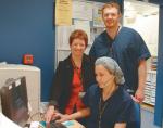 Sheila Kavanagh shows Through The Fire to Royal Adelaide Hospital burns nurses Stuart Harper (back) and Natalia Adanichkin