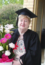 University of Adelaide graduate Dr Mary Maxwell wearing her mothers academic gown from the 1930s