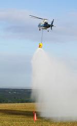 A helicopter applies treatment to an otherwise inaccessible area affected by Branched broomrape
Photo by Dr John Matthews