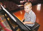 P-plate piano student Jacob, 7, is at the start of a long journey down the road towards an AMEB diploma, considered the national benchmark for music education.
Photo by Candy Gibson