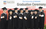 MBA graduates celebrate after the Singapore graduation ceremony.