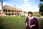 Manager Lynette Zeitz in period costume outside Urrbrae House