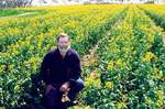 2006 Award of Merit winner Brian Wilson in a canola field on his property in Lismore
Photo courtesy of ROCA