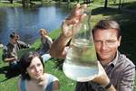 Associate Professor Holger Maier (right) with some of his students, Liam Harnett, Meredith Gee, and Brittany Coff (at front) on the banks of the Torrens River
Photo by Greg Adams, courtesy of <i>The Advertiser</i>