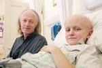 Dr Gordon Howarth (left) with Womens and Childrens Hospital cancer patient, 11-year-old John Nicholls, who is receiving chemotherapy and radiotherapy for a head and neck tumour. John is highly susceptible to mucositis, the focus for 
Dr Howarths research.
Photo by Candy Gibson
