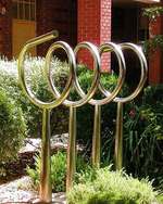 <i>Continuum</i> by Bert Flugelman in stainless steel. The sculpture is located outside the Johnson Building, North Terrace Campus. Image courtesy of Art & Heritage Collections