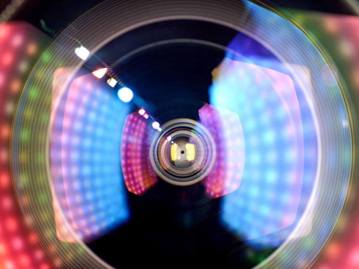 camera lens seen up close with multiple light reflections