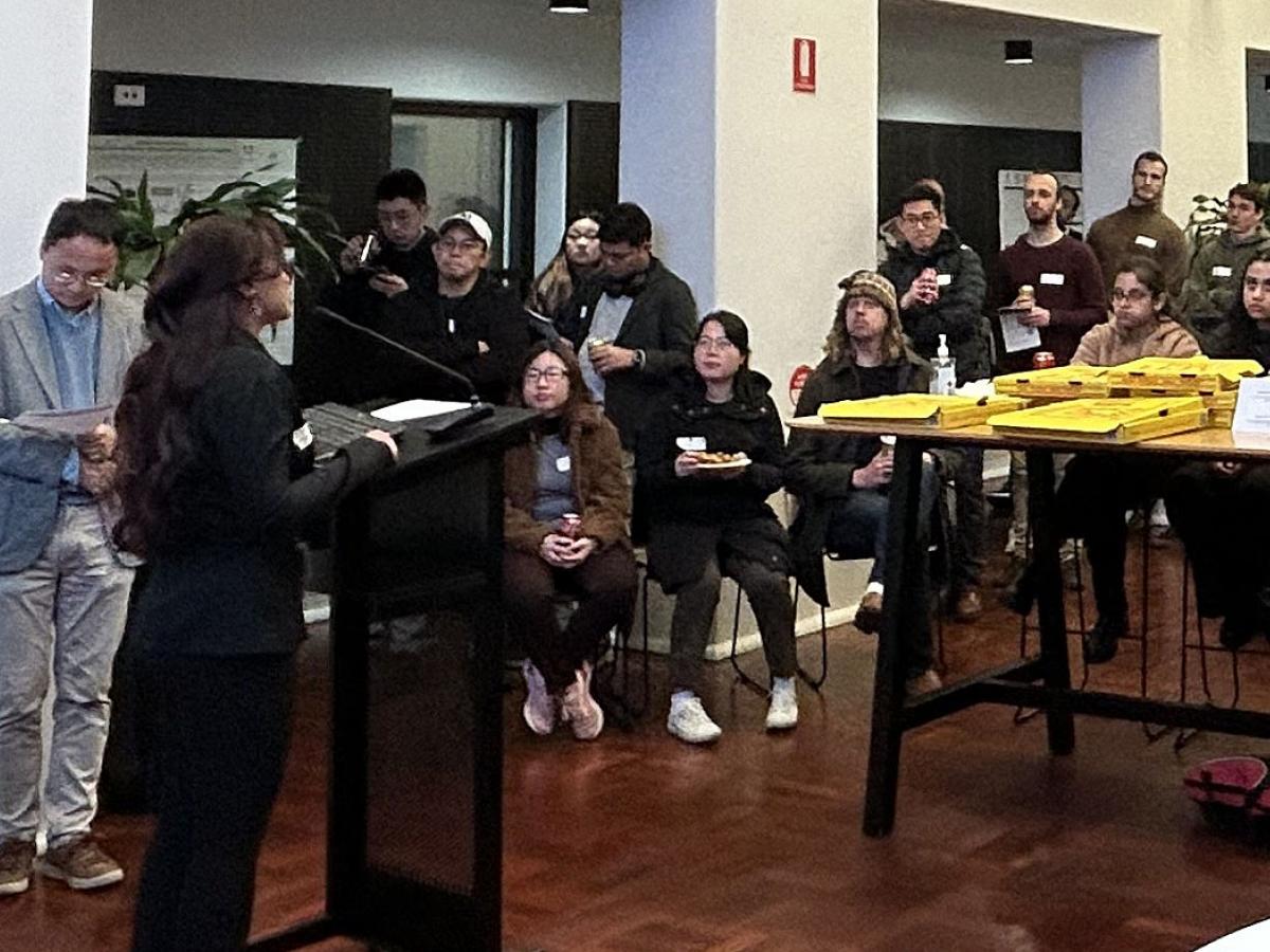 Dr Dhani Dharmaprani speaks before HDR students