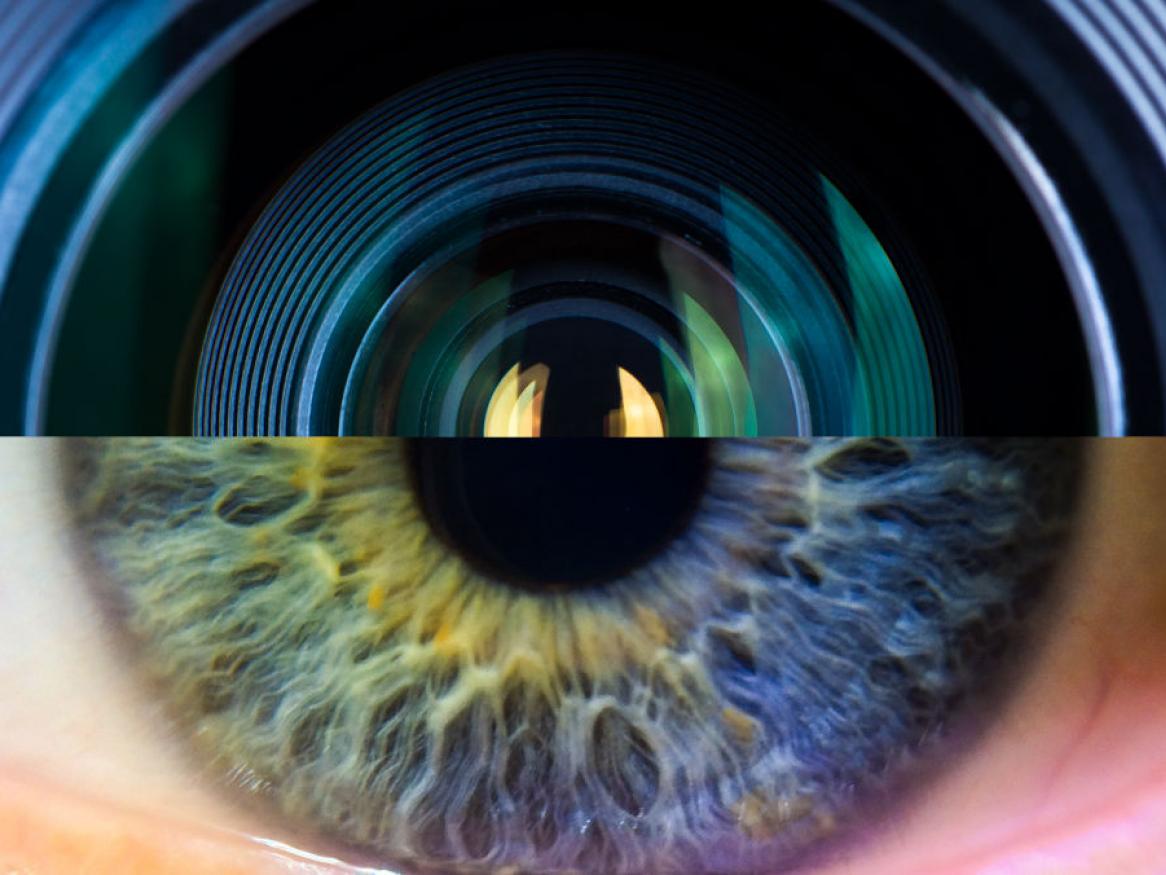 a composition showing half of a camera lens against half of a human eye close up