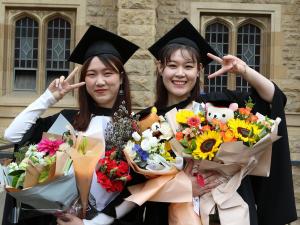 Graduates with flowers
