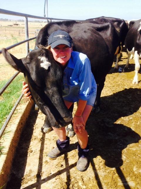 Image of Emma Goode with a cow