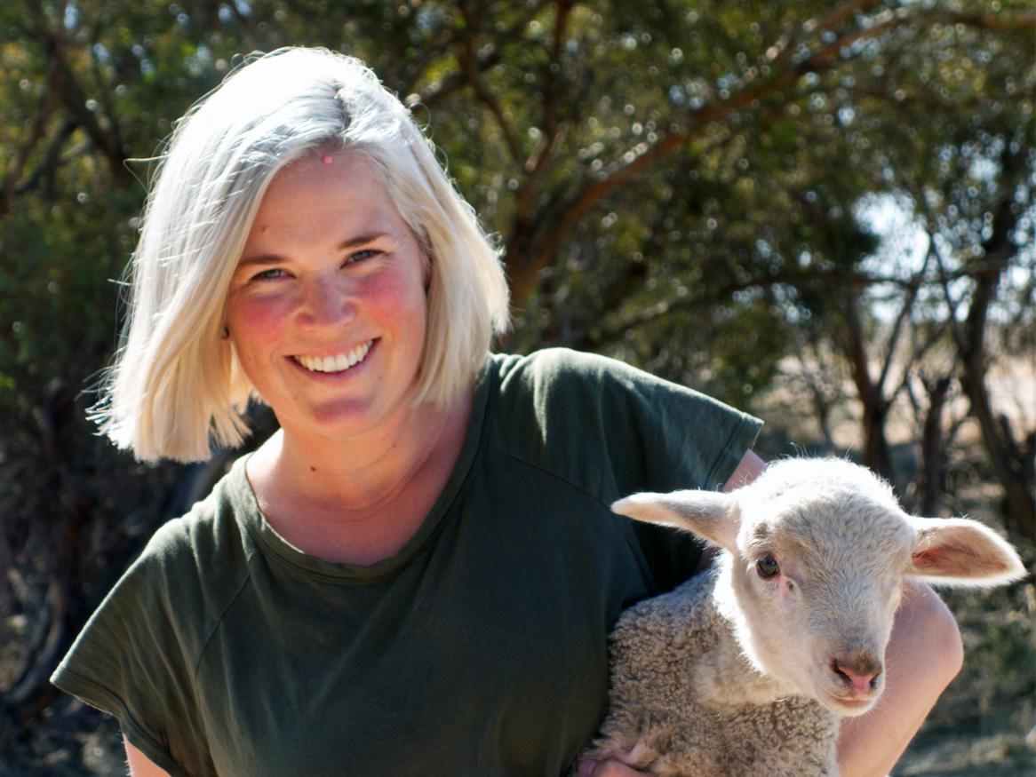 Lou Flohr holding a lamb