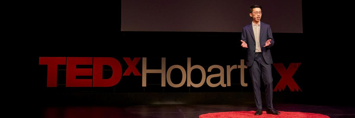 Dr Quek on stage at TEDx Hobart