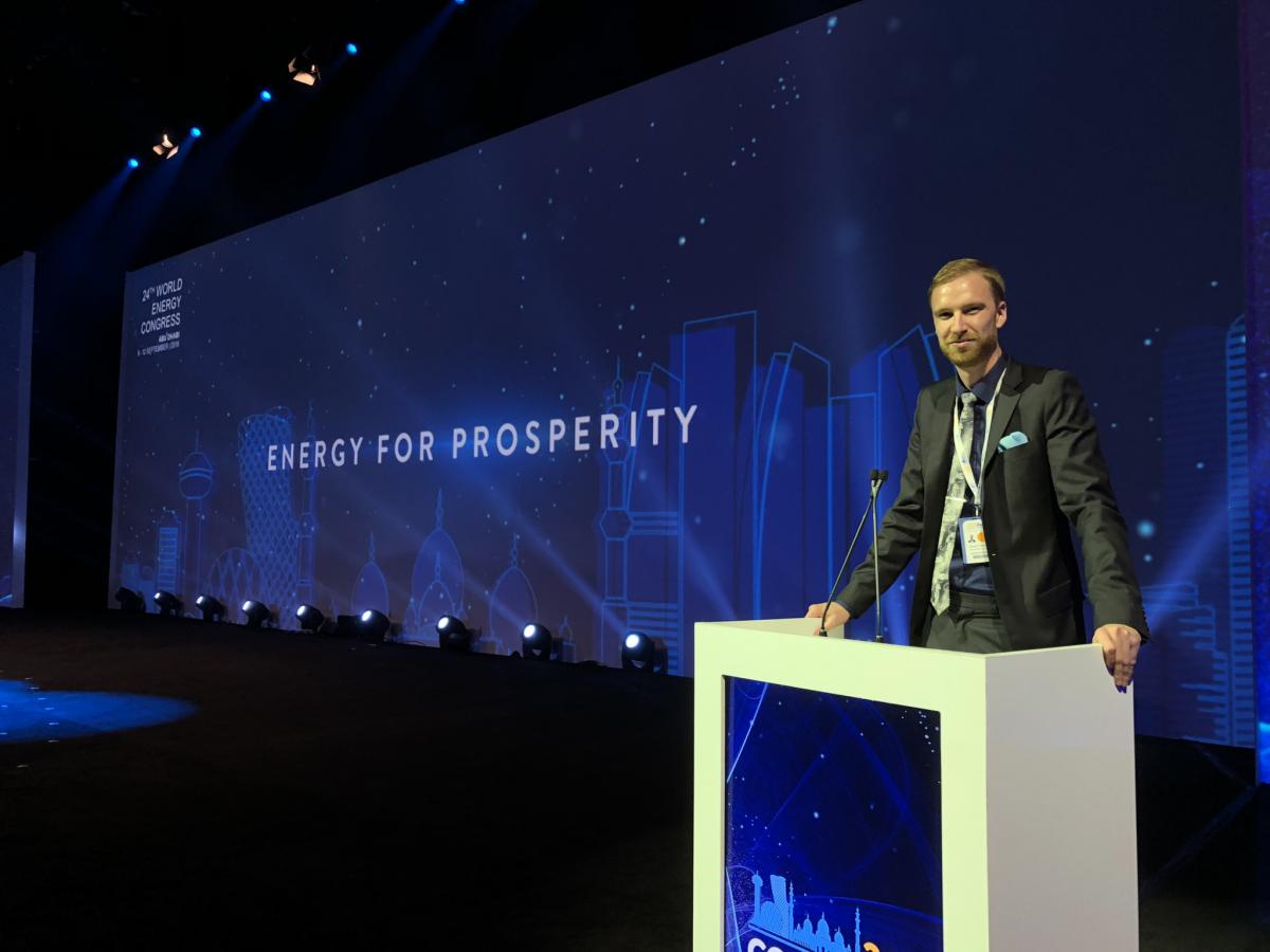 Randolf presenting on a large stage