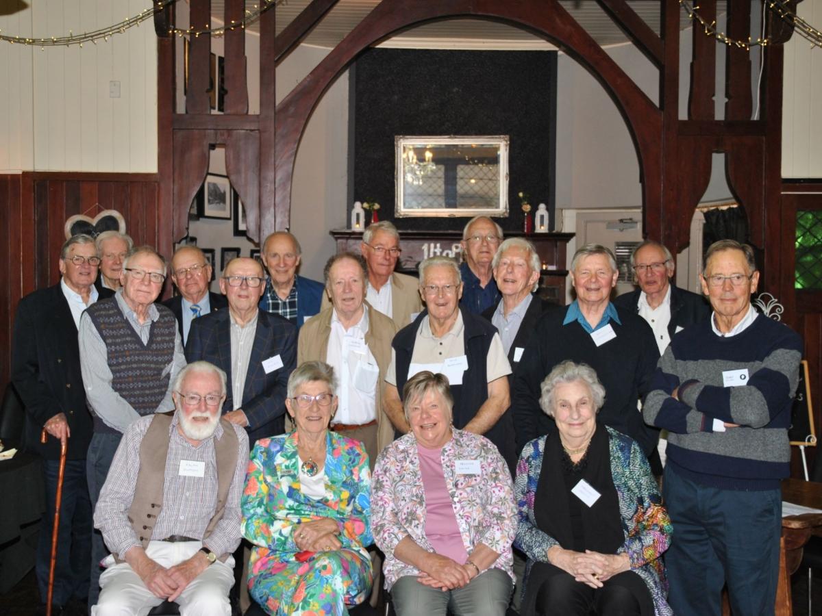 About 20 alumni of the medical class of 1966 posing for a photo in 2024