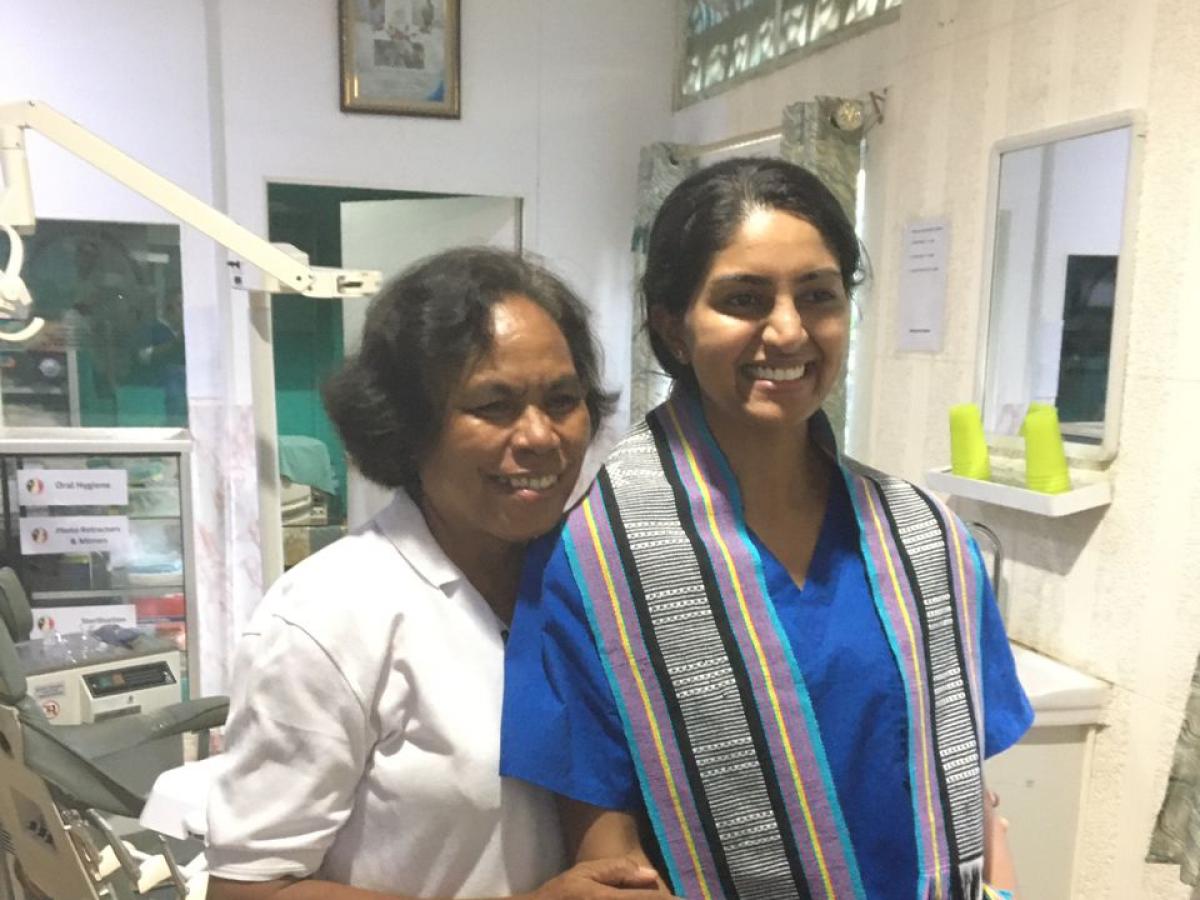 Dr Kumarasinghe wears a tais (traditional textile of Timor Leste) with Maria Dias (PAS Clinic Founder and Coordinator)