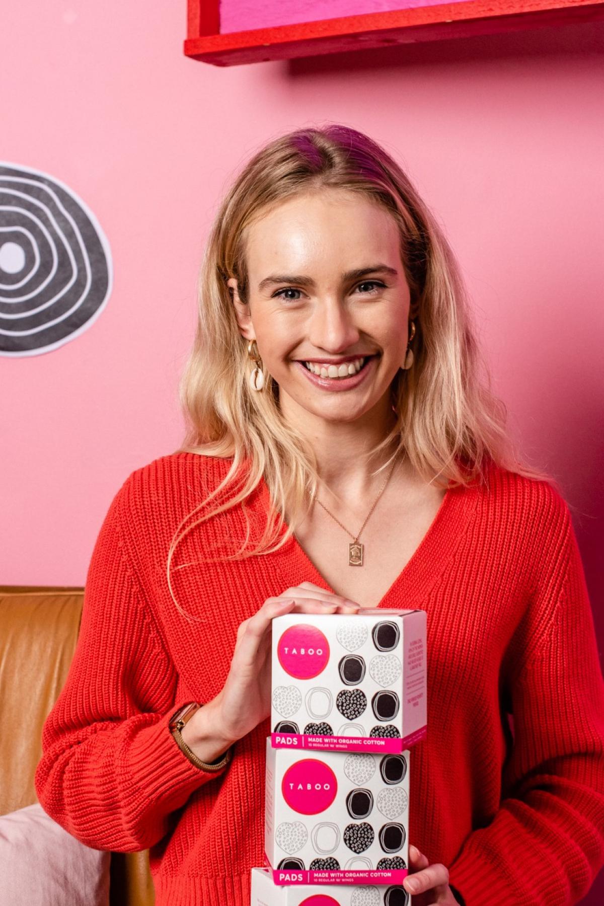Isobel Marshall holding Taboo product boxes