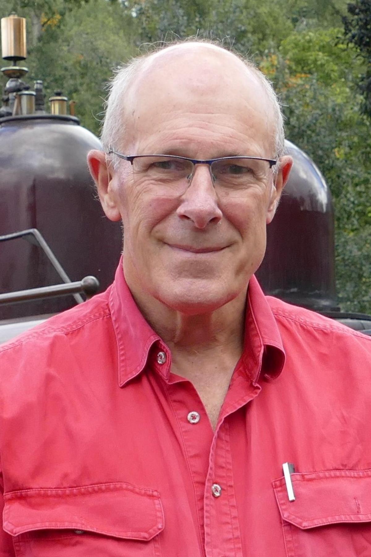 A portrait of Alan Richardson smiling