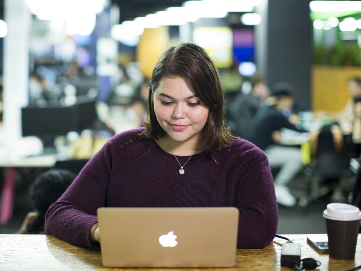 Woman looking at laptop