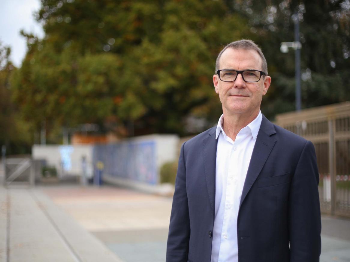 A portrait of John Scanlon in the street