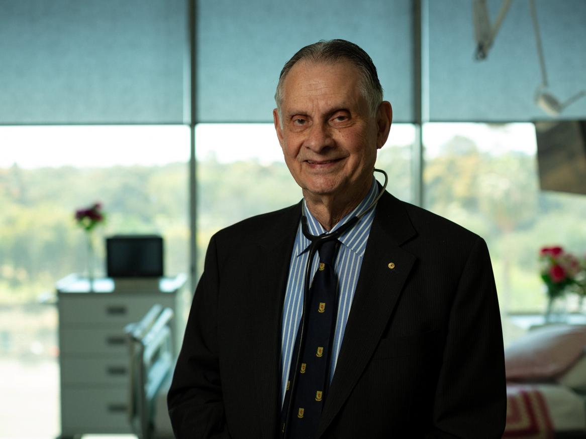 Prof Derek Frewin portrait in hospital room