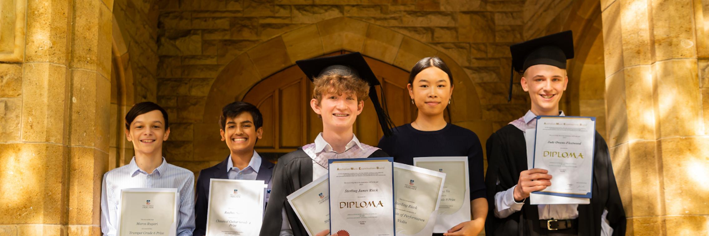 photos of students with AMEB awards and diplomas