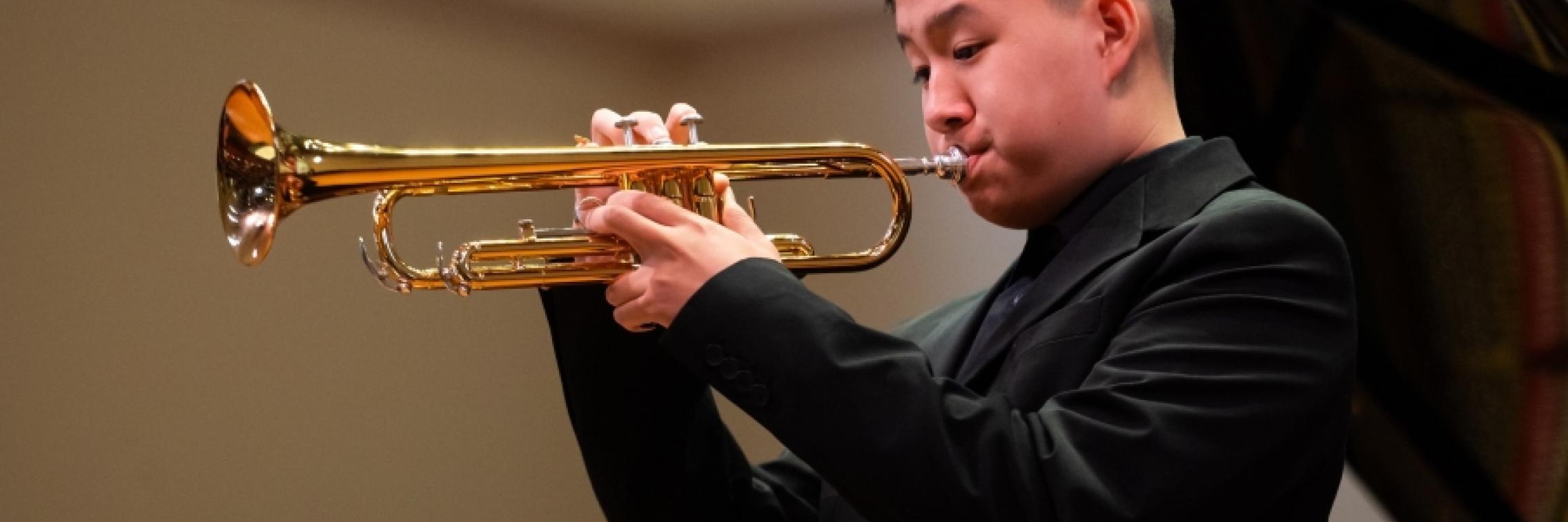 Boy playing trumpet