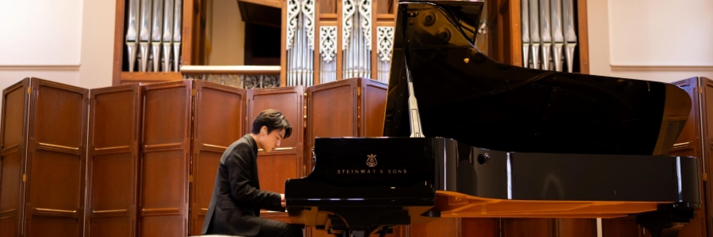 Concert performer playing piano