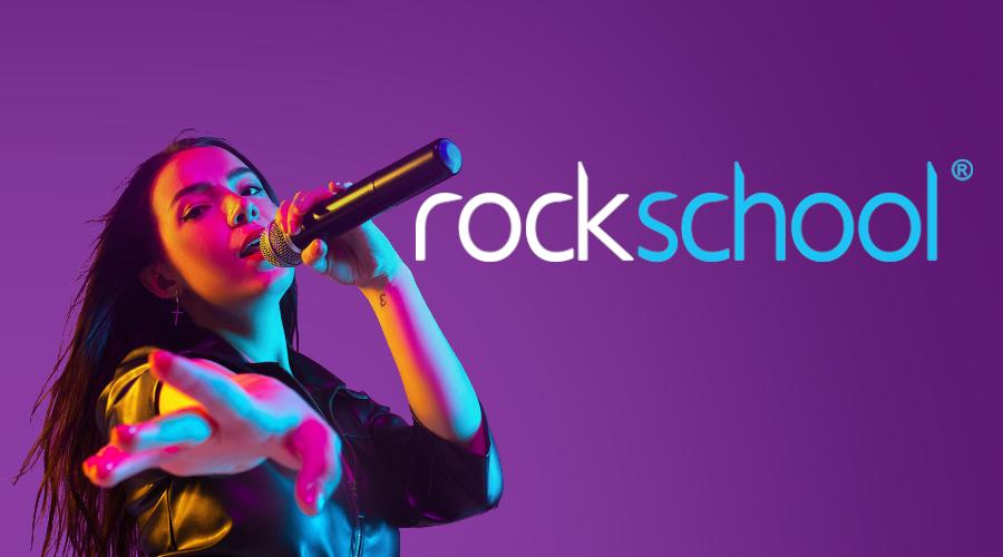 Girl singing beside rockschool logo