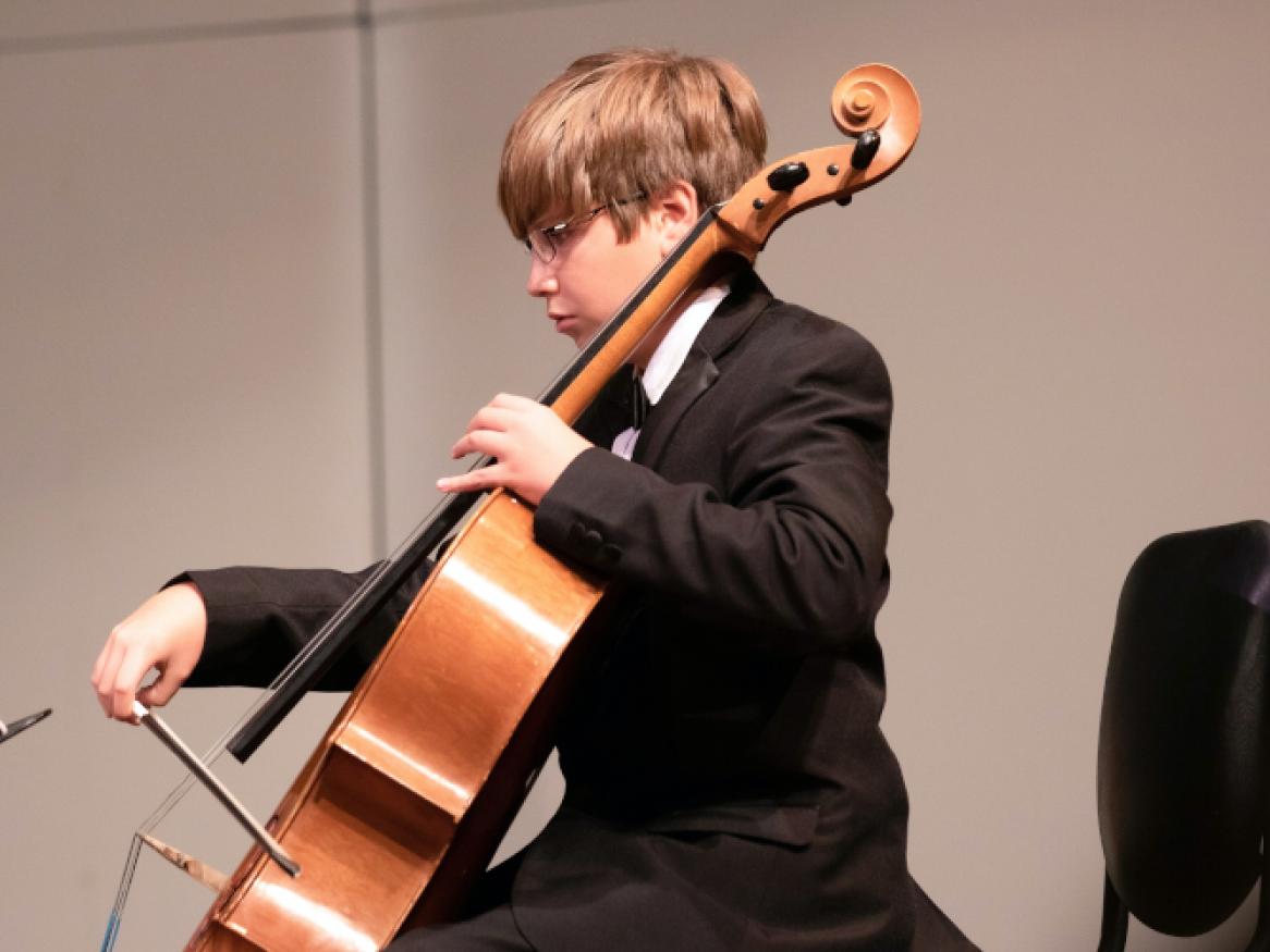 Boy playing cello