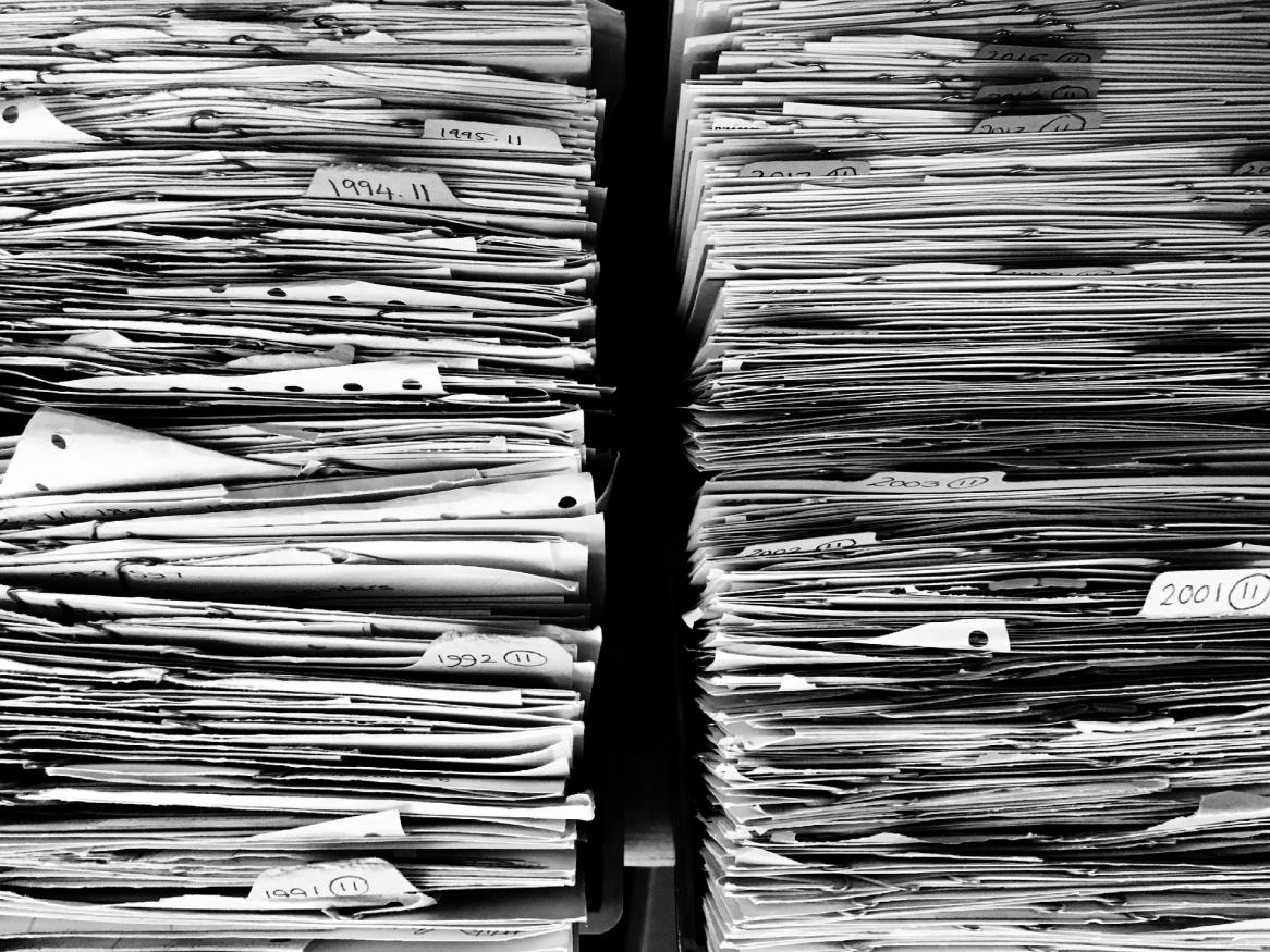 Black and white image of paper files