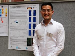 Xiaopeng Bi with his poster