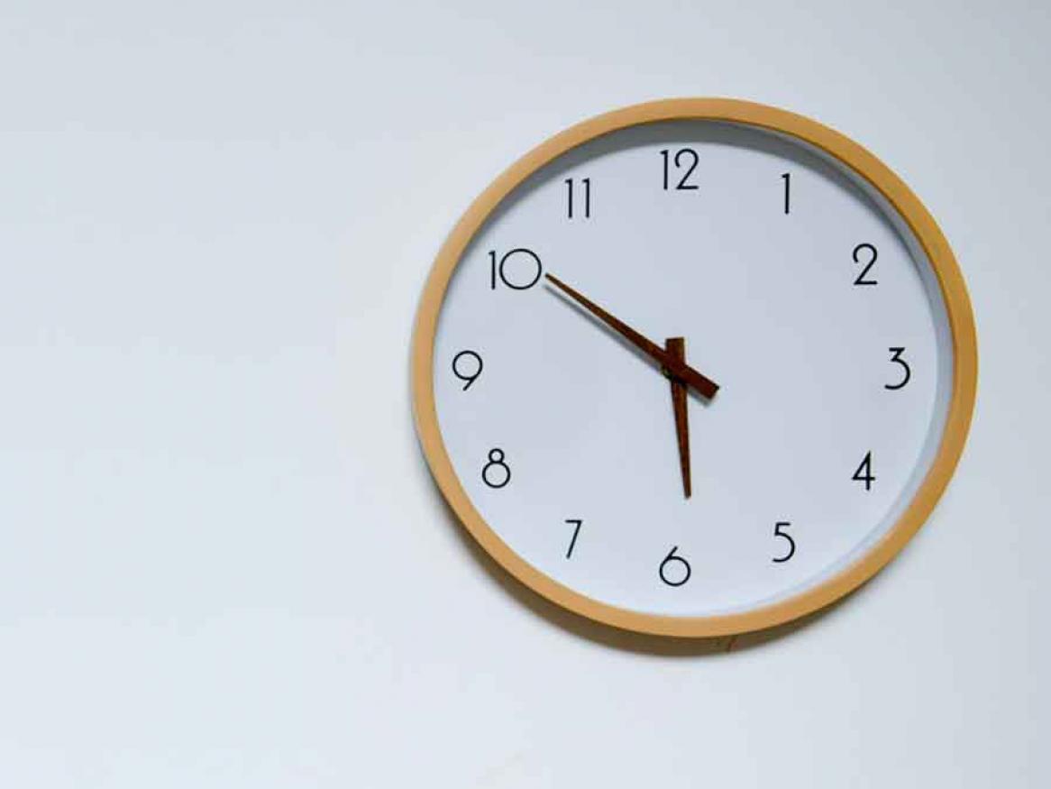 Wall clock on white wall