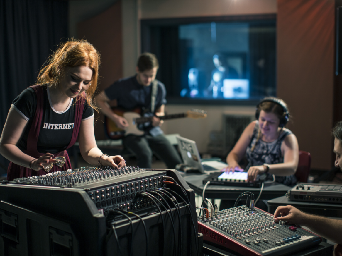 People working in a music studio