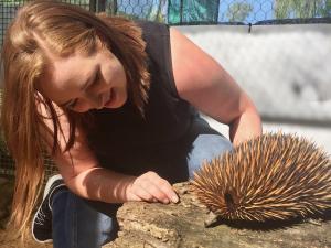 Tahlia Perry with echidna