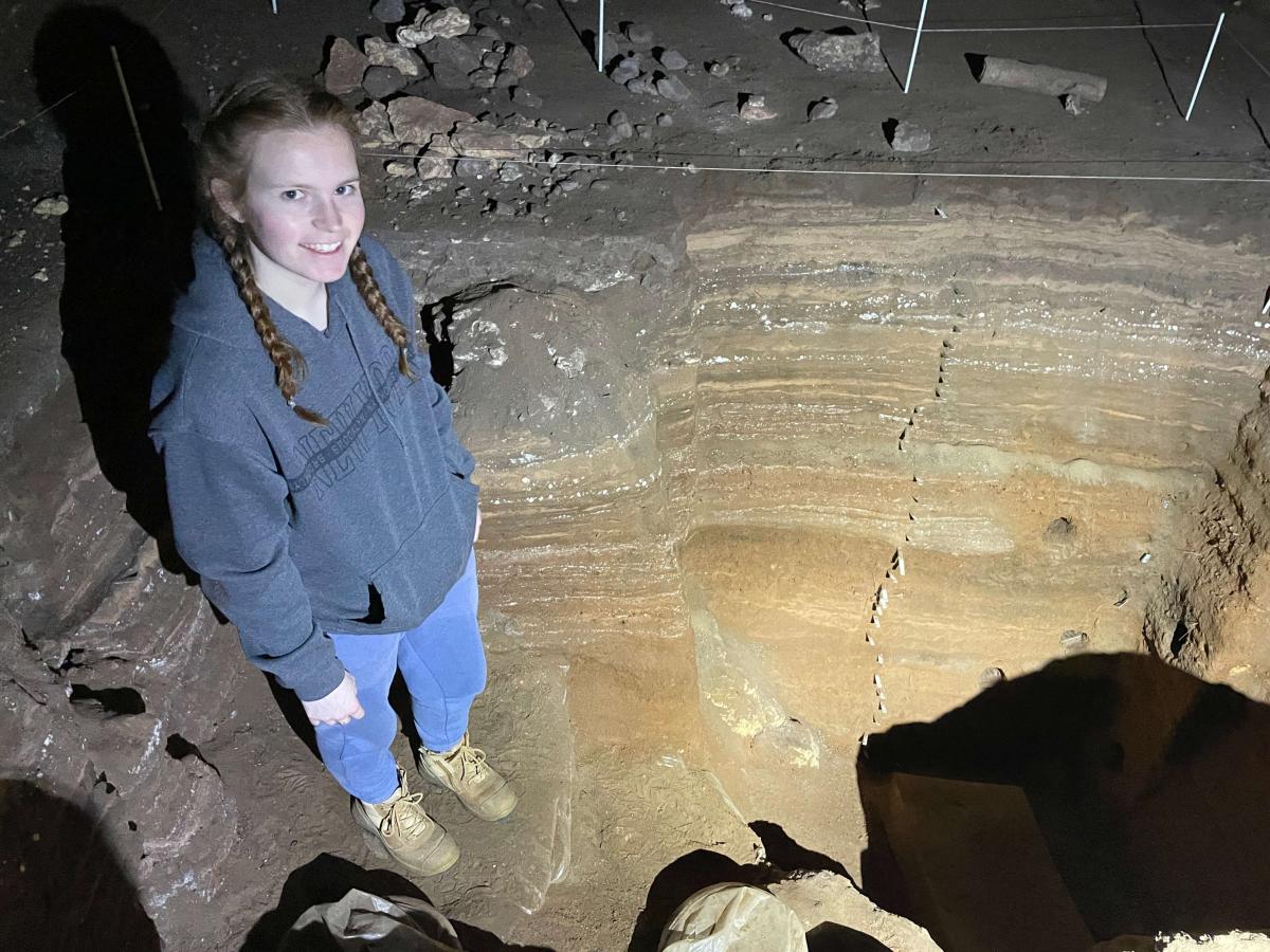 Photo of Siobhan in a cave looking up