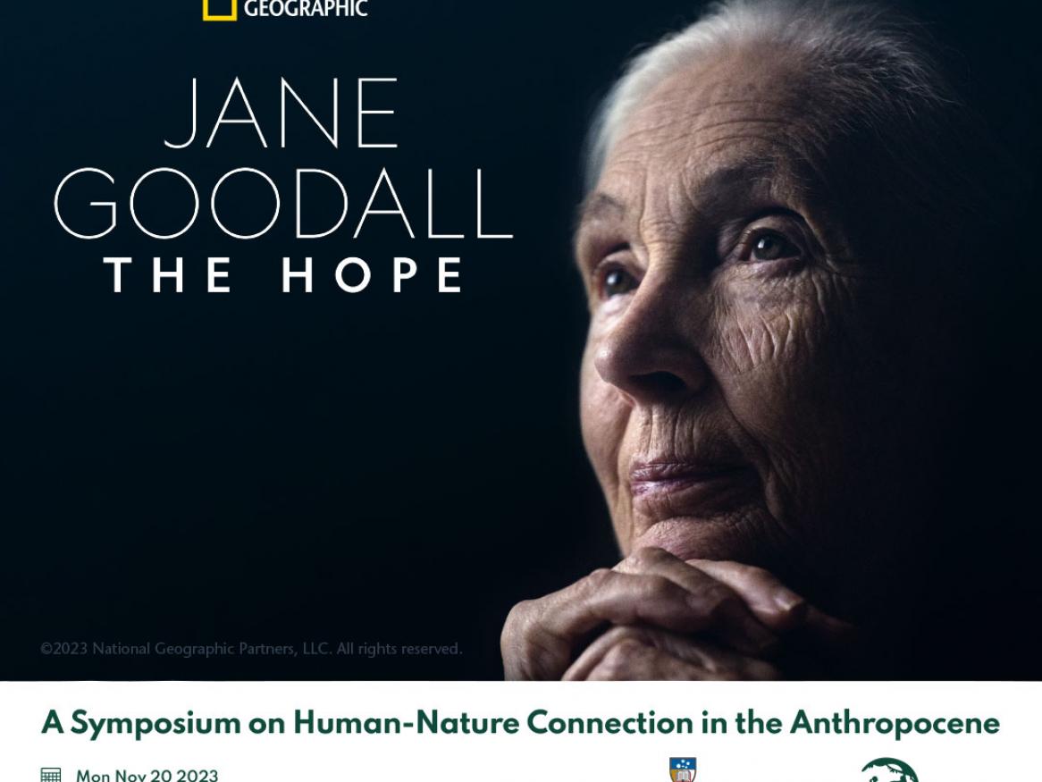Jane Goodall with black background looking into the distance