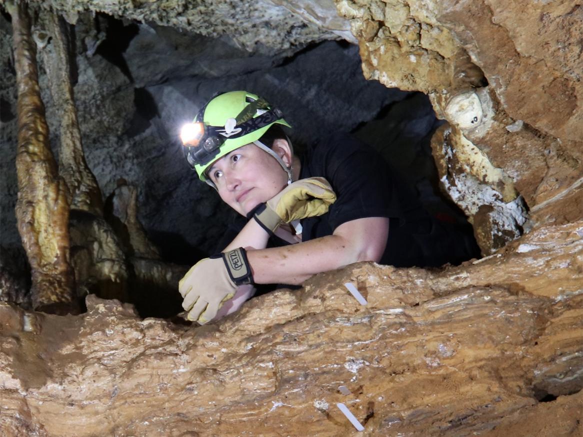 Photo of person in a cave