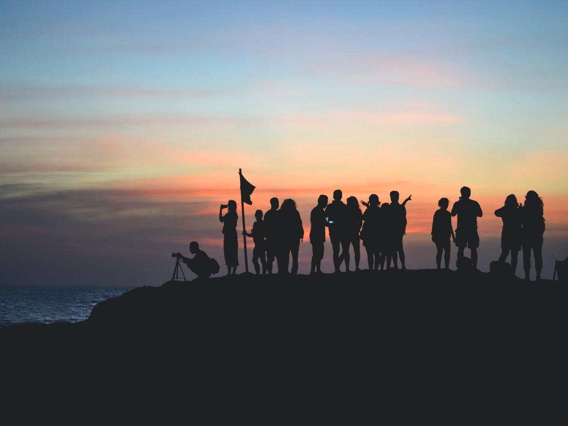 Team of people standing on mountain